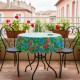 Round Mexican oilcloth tablecloth on a small balcony table, Capullo Green model - Casa Frida