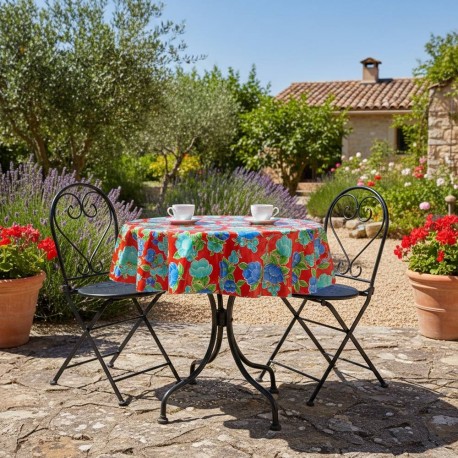 Tischdecke mit Blumenmuster aus mexikanischer Wachstuch auf einem runden Gartentisch, Modell Capullo Rot - Casa Frida